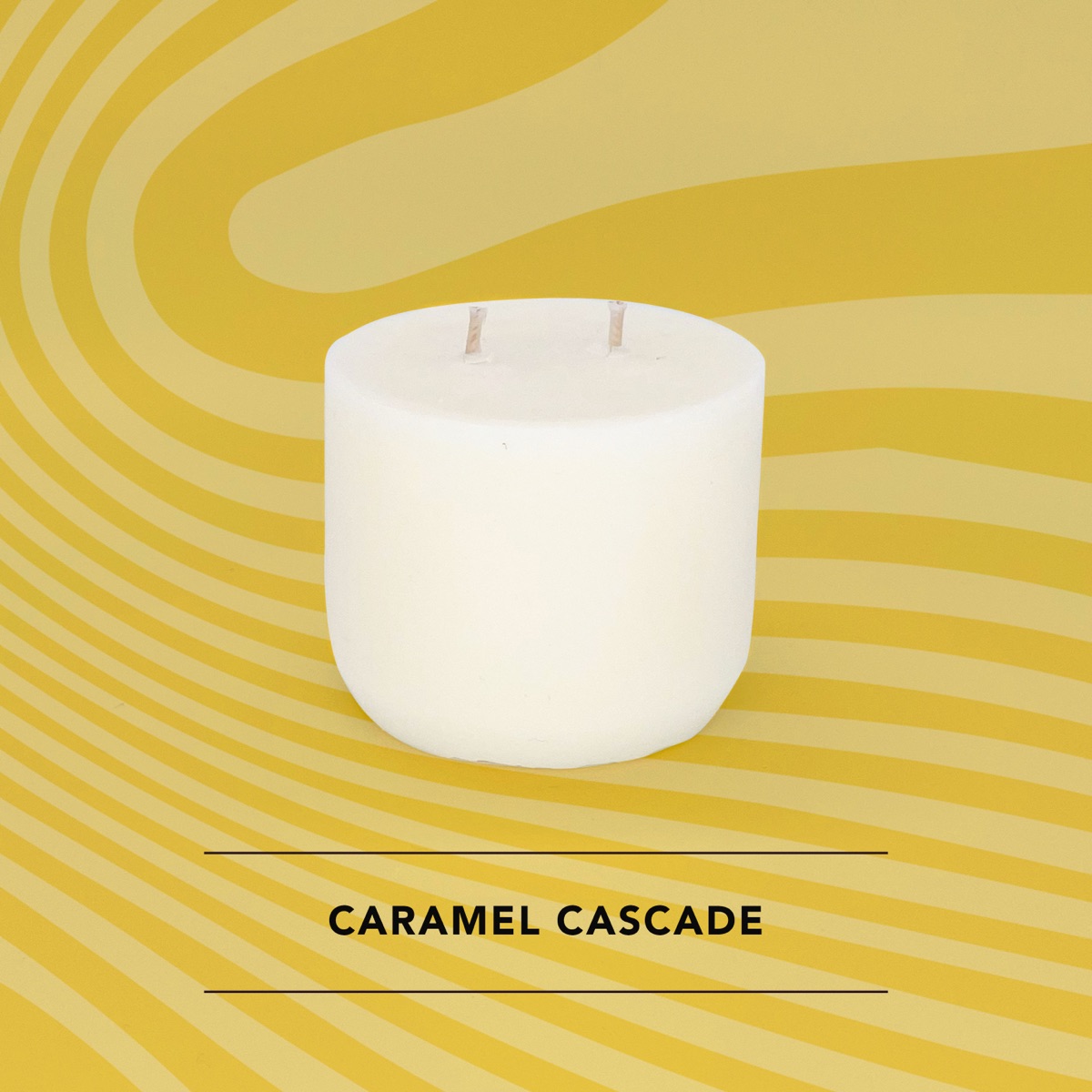 Honey Willow Caramel Cascade soy candle in a white vessel against a golden swirl background