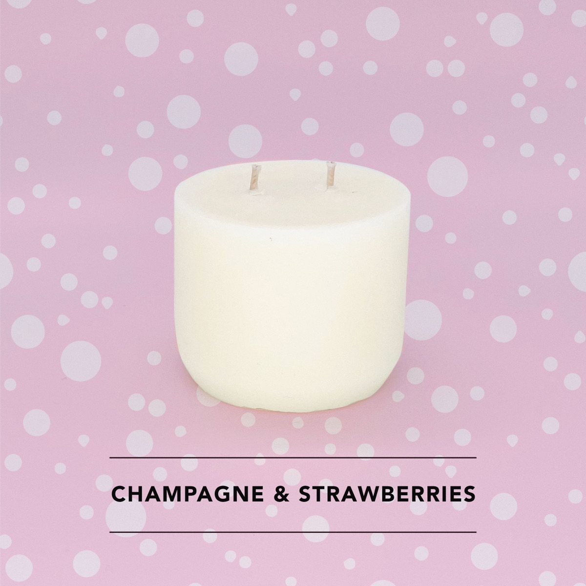 Honey Willow Champagne and Strawberries soy candle in a white vessel against a pink polka dot background