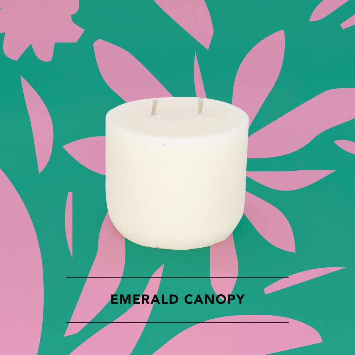 Honey Willow Emerald Canopy soy candle in a white vessel against a green and pink leaf print background